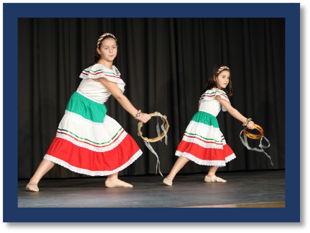 A couple of young girls dancing on stage